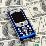 Mobile phone on money background, business concept